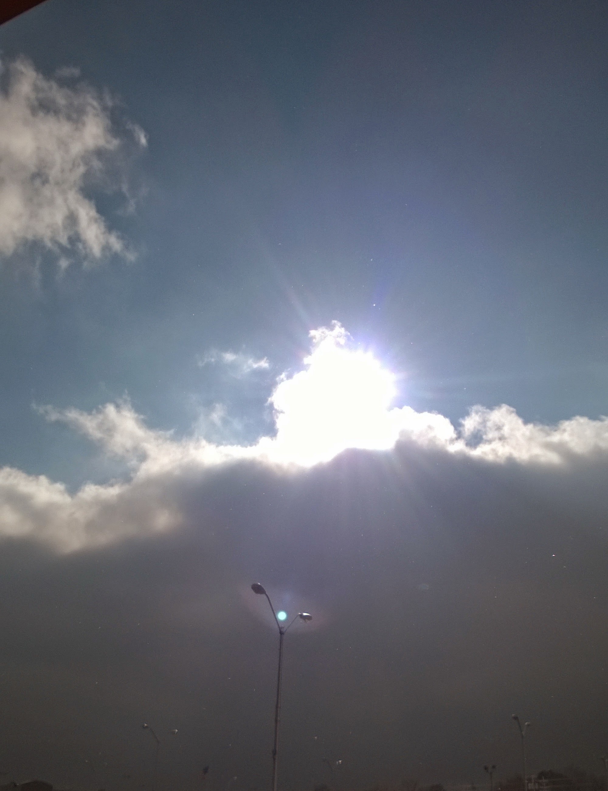 Sun shining thru clouds